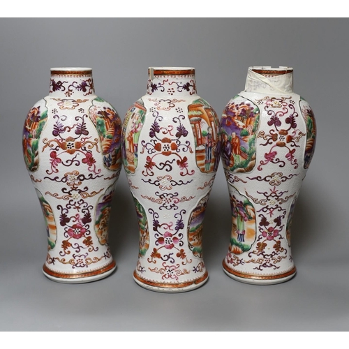 349 - A set of three Qianlong famille rose baluster vases, 24.5cm tall