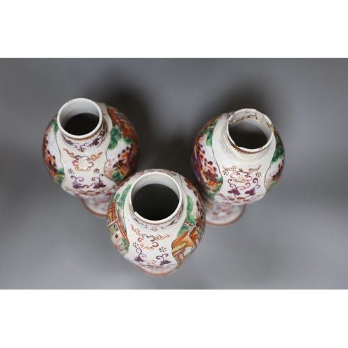 349 - A set of three Qianlong famille rose baluster vases, 24.5cm tall