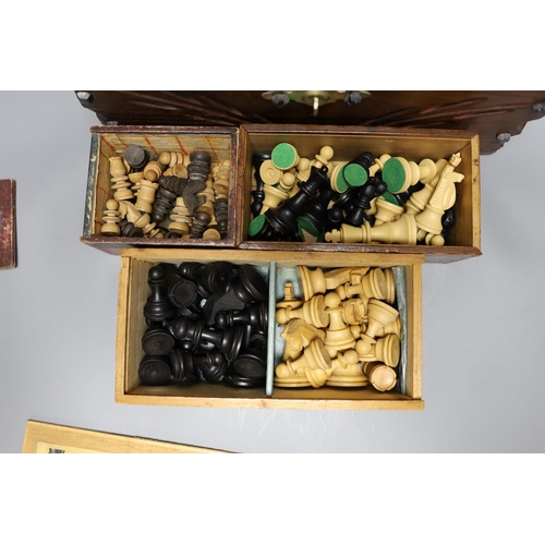 358 - A Chinese carved wood chess set in carved mahogany box, together with three others and a dominoes se... 