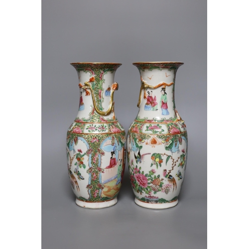 363 - A pair of 19th century Chinese Canton ceramic vases, 25.5cm tall