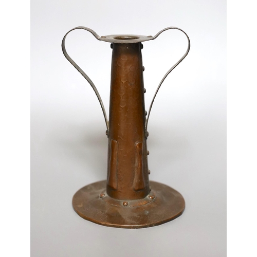 364 - An Arts and Crafts hammered copper candlestick, 18cm tall, and a copper hanging letter rack