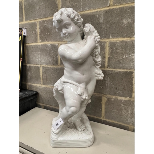 38 - A glazed earthenware cherub ornament, height 87cm