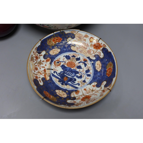 397 - An 18th century Japanese Imari dish (af), another Imari dish, an 18th century Chinese export bowl (a... 