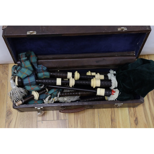 399 - A set of bagpipes, cased.