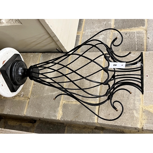 40 - A painted wrought iron vase shaped ornament on painted fluted pedestal, total height 139cm