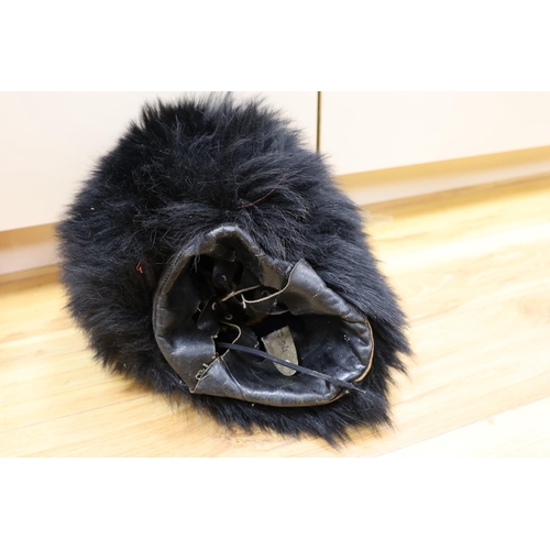 402 - A Royal Horseguard's helmet and Queens guard bearskin