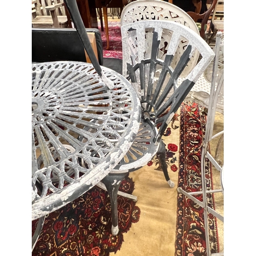 41 - A circular aluminium garden table and two chairs, table diameter 69cm height 67cm