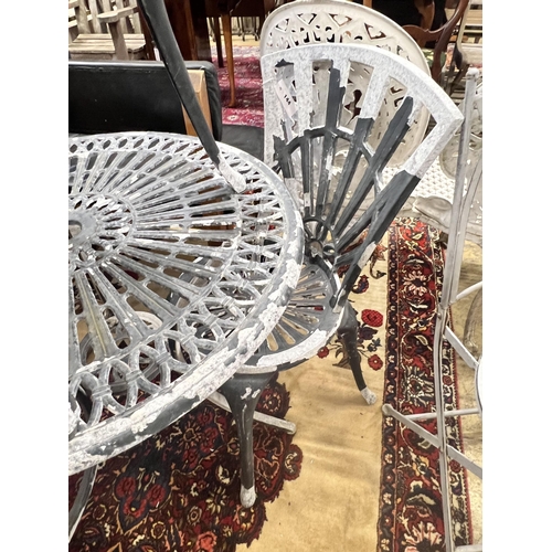 41 - A circular aluminium garden table and two chairs, table diameter 69cm height 67cm