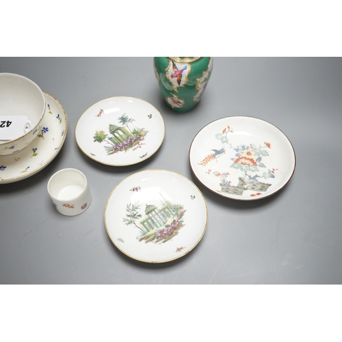 425 - A rare Nyon porcelain slop bowl and saucer, a Meissen saucer and cylindrical pot and a pair of Germa... 