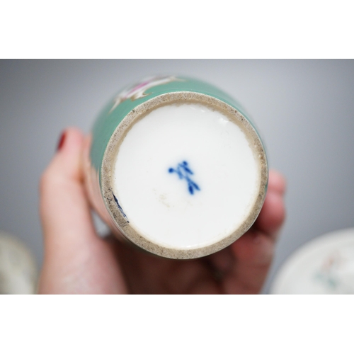 425 - A rare Nyon porcelain slop bowl and saucer, a Meissen saucer and cylindrical pot and a pair of Germa... 