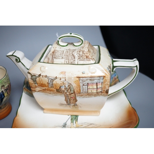 426 - A Royal Doulton Charles Dickens ware teapot, a beaker and four dishes (6)