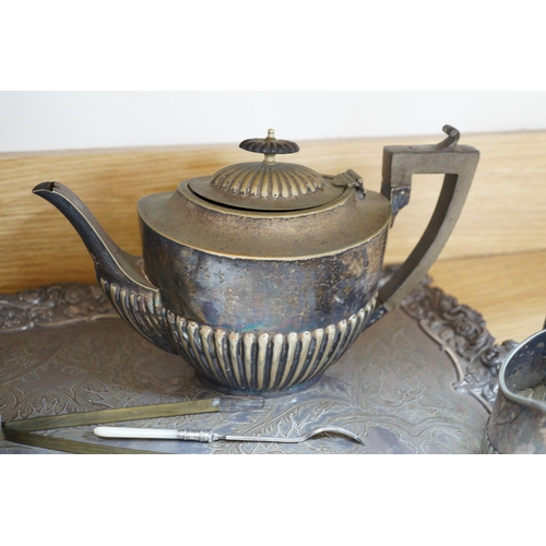 447 - A silver plated two handled tea tray and seven other plated items, tray length 80cm