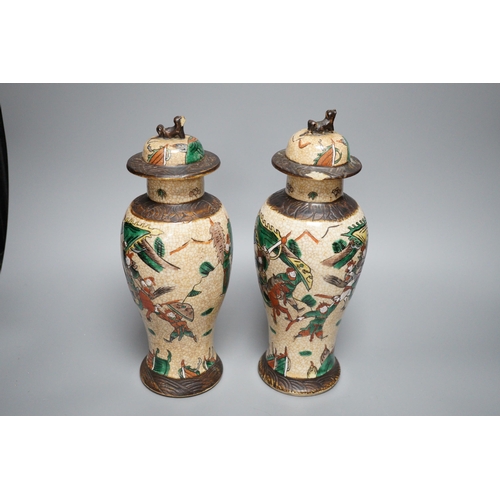 451 - A pair of Chinese crackleware lidded vases, 30cm