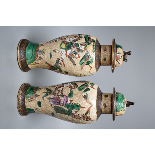 451 - A pair of Chinese crackleware lidded vases, 30cm