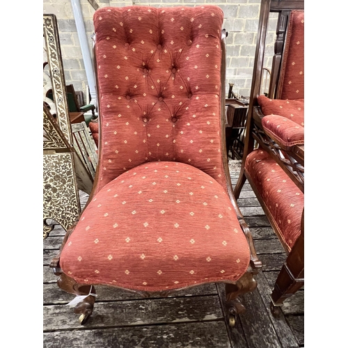 46 - A late Victorian mahogany open armchair and an early Victorian rosewood nursing chair