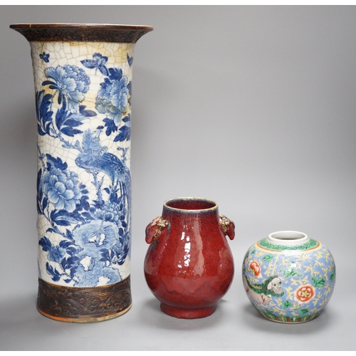 473 - A large Chinese blue and white crackle glaze vase, a sang de boeuf vase and a monochrome jar, talles... 