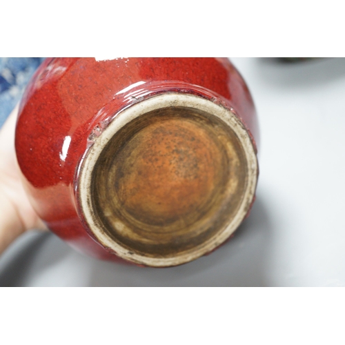 473 - A large Chinese blue and white crackle glaze vase, a sang de boeuf vase and a monochrome jar, talles... 