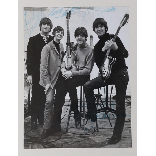 475 - A Beatles signed photo in glazed frame, 23 x 17cm, bearing the signature of all four members with ac... 