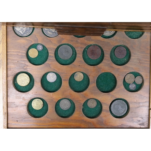 476 - A collection of mixed coinage in a collectors cabinet, 27cm tall