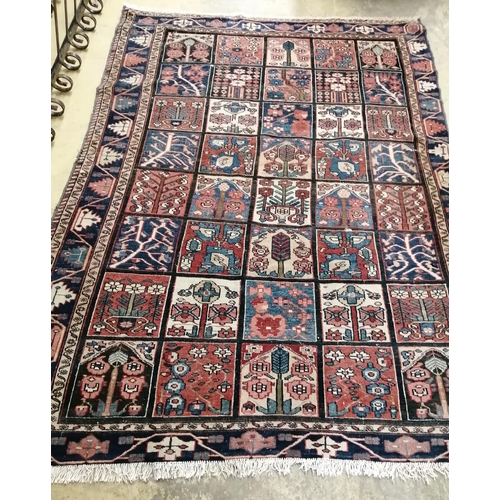 60 - A Baktiari blue ground rug, 202 x 144cm