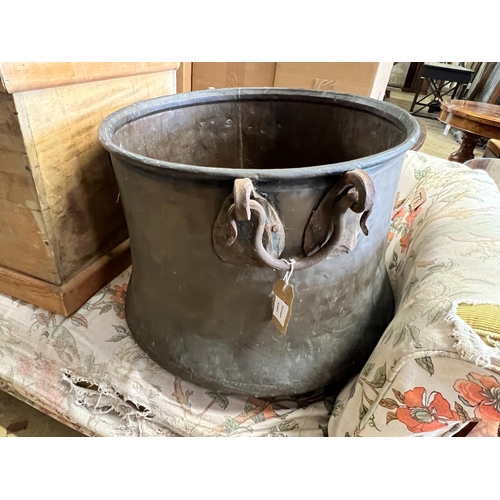 63 - A Victorian circular copper cauldron with wrought iron handles, diameter 56cm, height 42cm