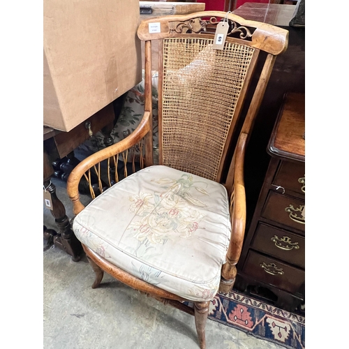 69 - A Victorian maple framed caned back armchair