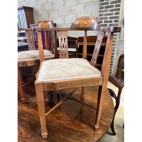 74 - A pair of Edwardian inlaid mahogany corner elbow chairs