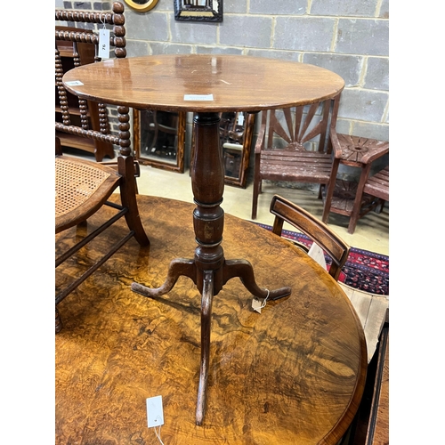 77 - A George III mahogany circular top tripod wine table, diameter 50cm, height 69cm