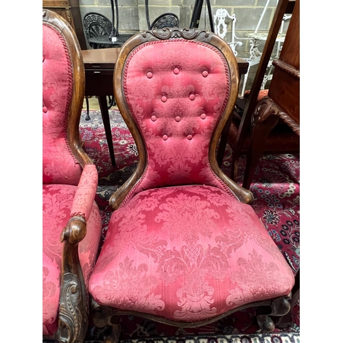 89 - A pair of Victorian walnut spoon back upholstered chairs, one with arms