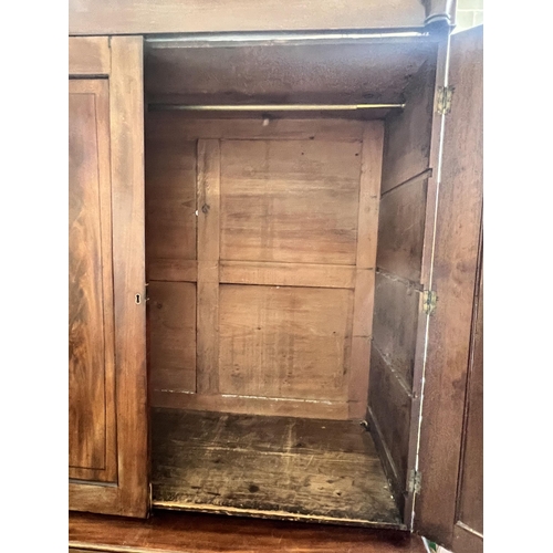 9 - A Regency mahogany linen press, converted to a hanging wardrobe, width 122cm depth 55cm height 216cm... 