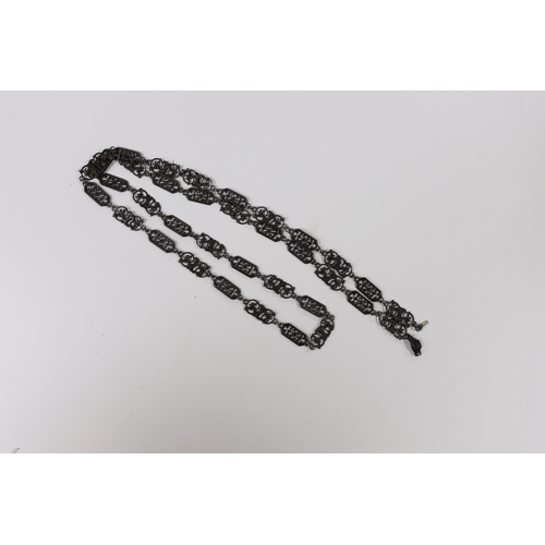 970 - A 19th century Berlin iron work long necklace, with pierced octagonal and scrolling links, the clasp... 