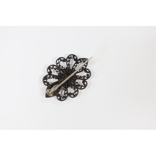 971 - A 19th century Berlin iron work brooch, of shaped oval flower head form (repair), 49mm.