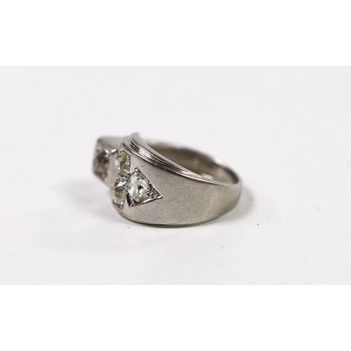 972 - A continental 750 white metal and four stone diamond set dress ring, size H, gross weight 6.1 grams.... 