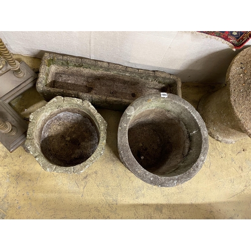 1004 - A Cotswold Studios rectangular reconstituted stone garden planter together with two circular planter... 