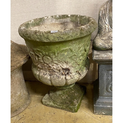 1006 - A circular reconstituted stone garden planter, diameter 47cm, height 60cm