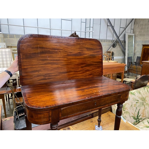 1024 - A George IV Gillows style ebony strung mahogany folding tea table on fluted legs width 99cm, depth 4... 