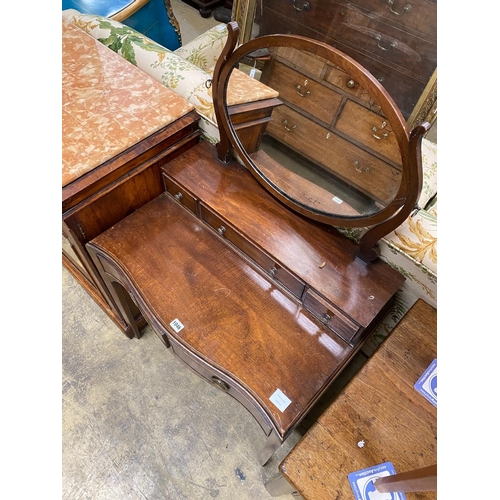 1027 - A George III style mahogany serpentine dressing table, width 72cm, depth 46cm, height 120cm