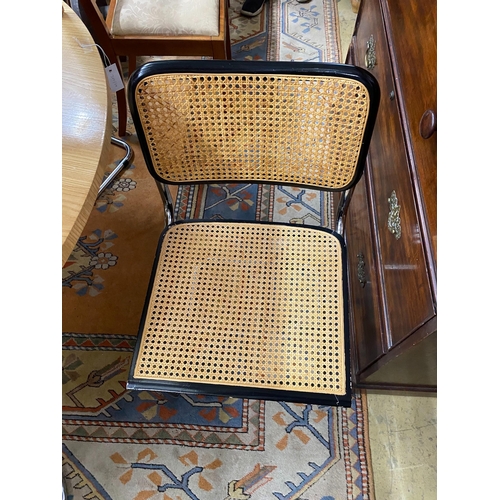 1034 - Six caned ebonized cantilever dining chairs in the style of Knoll Cesca by Marcel Breuer