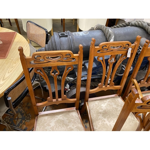 1036 - Five Art Nouveau walnut dining chairs, one with arms