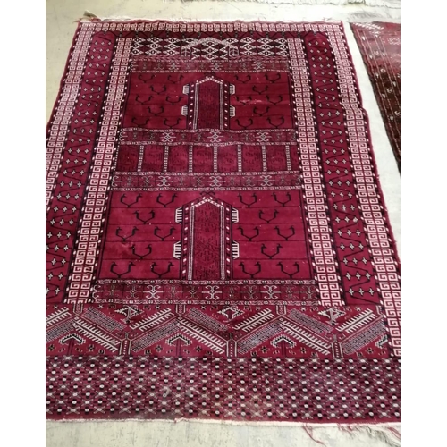 1043 - Two Bokhara / Belouch red ground rugs, larger 190 x 120cm