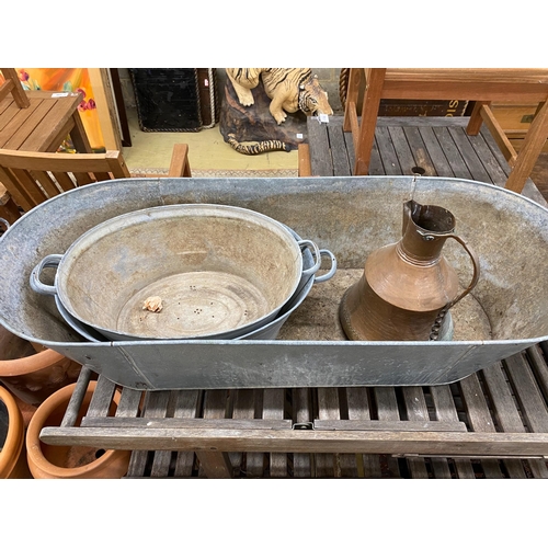 1071 - Three oval galvanised containers and a Turkish copper pot, largest length 135cm