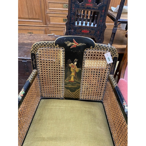 1074 - A 1920's Chinoiserie lacquer bergere armchair, width 64cm, depth 65cm, height 85cm