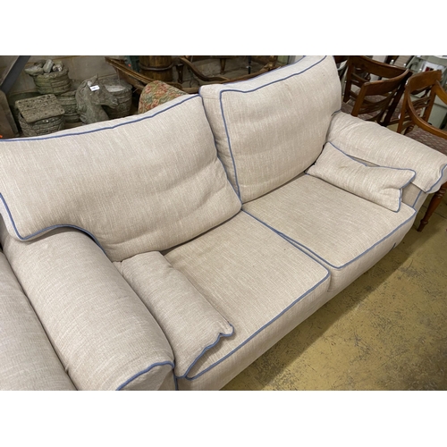 1084 - Two cream upholstered settees, with blue corded edging, larger length 200cm, depth 100cm, height 97c... 