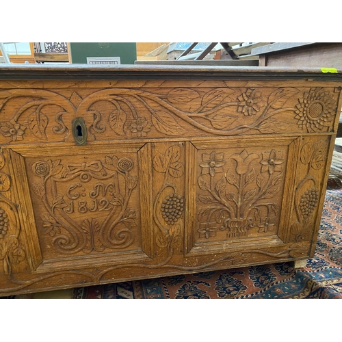 1101 - An 18th century and later carved oak coffer, length 134cm, depth 56cm, height 61cm