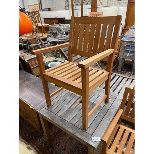 1103 - A weathered teak square garden table, width 80cm, height 73cm together with two teak elbow chairs... 