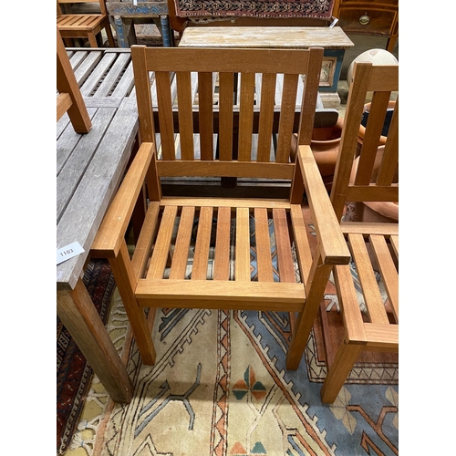 1103 - A weathered teak square garden table, width 80cm, height 73cm together with two teak elbow chairs... 