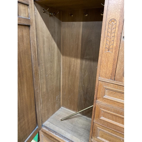 1115 - A late 19th century German Art Nouveau oak compactum wardrobe, length 224cm, depth 56cm, height 204c... 