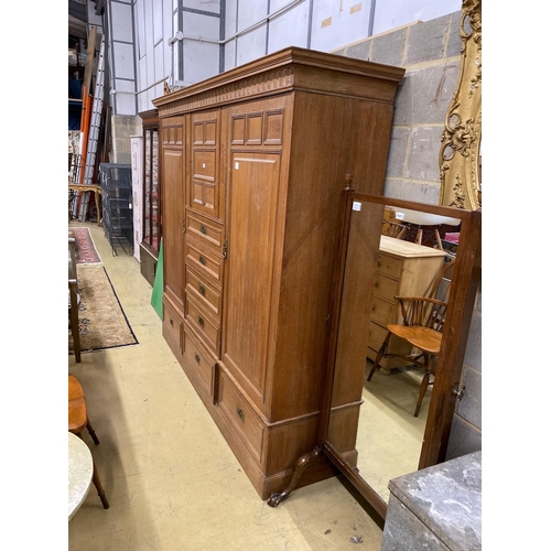 1115 - A late 19th century German Art Nouveau oak compactum wardrobe, length 224cm, depth 56cm, height 204c... 