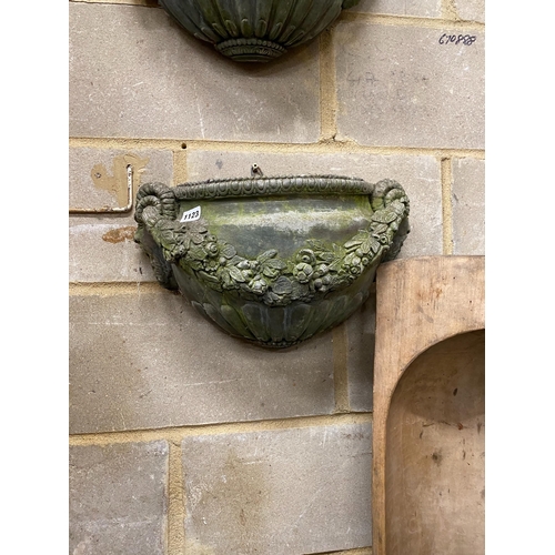 1123 - A pair of reconstituted stone garden wall planters, width 45cm, height 24cm