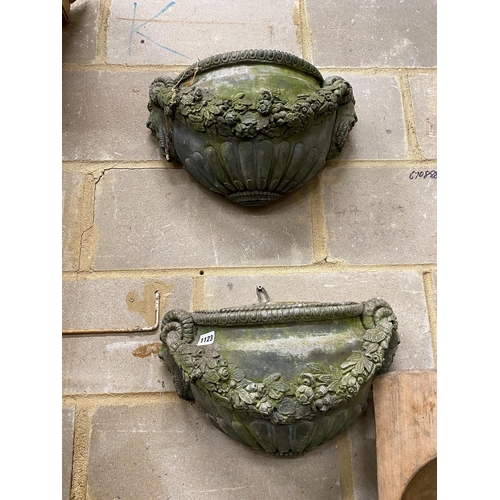 1123 - A pair of reconstituted stone garden wall planters, width 45cm, height 24cm